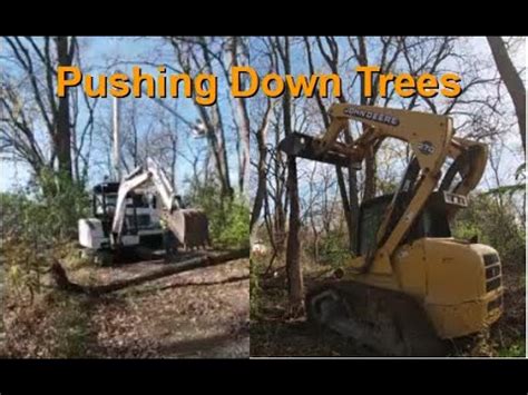 pushing trees with mini excavator|removing trees from excavators.